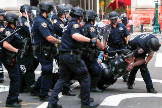 FILE PHOTO: The City Hall Autonomous Zone protest to defund the New York Police Department (NYPD) in Manhattan, New York City