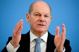 FILE PHOTO: German Finance Minister Scholz holds a news conference in Berlin