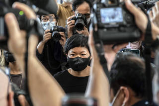 Choy Yuk-ling, a producer for Radio Television Hong Kong, center was found guilty on Thursday, April 22, 2021, of making false statements to obtain public records for a report that was critical of the police. (Lam Yik Fei/The New York Times)