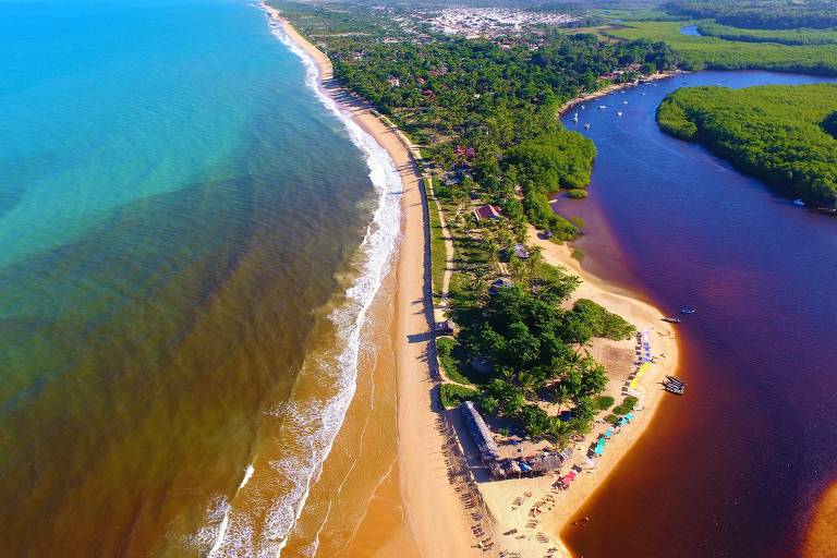 Caraíva, Bahia, Brazil: Aerial view of a beautiful beach with two colors of water. Fantastic landscape. Great beach view