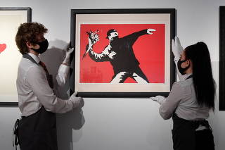 Artworks displayed ahead of online auction, 'Prints and Multiples and Banksy: I Can't Believe You Morons Actually Buy This Sh*t' at Christie's, London