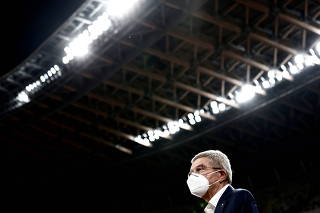 FILE PHOTO: Thomas Bach, International Olympic Committee (IOC) President speaks to the media as he visits the National Stadium, the main venue for the 2020 Olympic and Paralympic Games, in Tokyo
