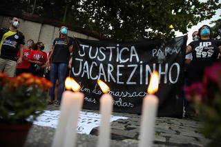 People protest against police violence outside Jacarezinho slum after a police operation which resulted in 25 deaths in Rio de Janeiro