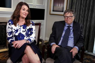 FILE PHOTO: Microsoft co-founder Bill Gates and his wife Melinda sit during an interview in New York