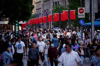 People walk along Nanjing Pedestrian Road, a main shopping area, following the outbreak of the coronavirus disease (COVID-19), in Shanghai