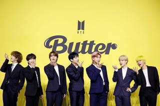 Members of K-pop boy band BTS pose for photographs during a photo opportunity promoting their new single 'Butter' in Seoul