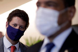 Brazil's Environment Minister Ricardo Salles walks before a news conference in Brasilia
