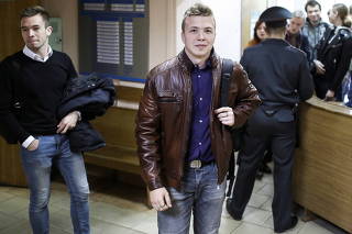 Opposition blogger and activist Roman Protasevich arrives for a court hearing in Minsk