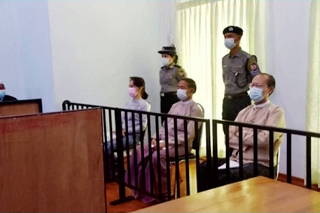 Myanmar state TV shows Suu Kyi in court in first pictures since coup
