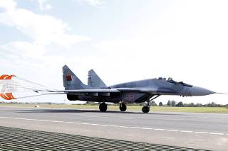 Belarussian MIG-29 military jet lands on the M1/E30 road during military exercises near the village of Krysovo, southwest of Minsk