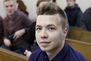 FILE PHOTO: Opposition blogger and activist Roman Protasevich attends a court hearing in Minsk