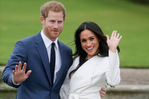 (FILES) In this file photo Britain's Prince Harry and his then fiancée US actress Meghan Markle pose for a photograph in the Sunken Garden at Kensington Palace in west London on November 27, 2017, following the announcement of their engagement. - After a week of digs at Britain's royal family, just how far will Prince Harry and Meghan Markle go in their hotly anticipated interview with Oprah Winfrey? Millions of people will tune in to CBS the evening of March 7, 2021 to find out, and if that trickle of excerpts is any indication, they have scores to settle with Buckingham Palace a bit over a year after giving up frontline duties as royals and moving to southern California. (Photo by Daniel LEAL-OLIVAS / AFP)