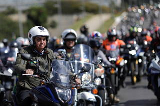 Brazil's President Jair Bolsonaro and his supporters ride motorcycles to celebrate the National Mother's Day