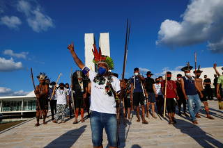 Indigenous Brazilians from different ethnic groups take part in a protest for land demarcation and against President Jair Bolsonaro's government, in Brasilia