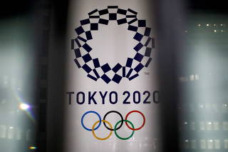FILE PHOTO: The logo of Tokyo 2020 Olympic Games is seen through signboards, in Tokyo