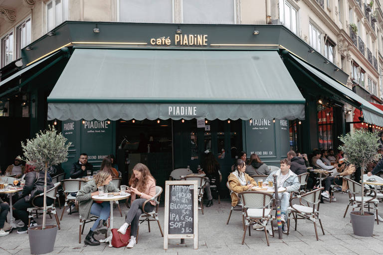 FILE Ñ Maskless customers at a cafe in Paris on May 19, 2021. Nearly 45 percent of the population in France has received at least one dose of a vaccine. (Andrea Mantovani/The New York Times)