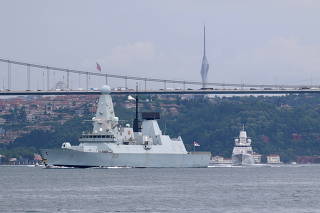 FILE PHOTO: Royal Navy HMS Defender sets sail in Istanbul's Bosphorus