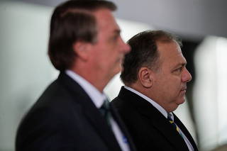 Brazil's President Jair Bolsonaro and Brazil's Health Minister Eduardo Pazuello arrive to a ceremony, in Brasilia