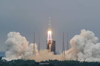FILE PHOTO: FILE PHOTO: Long March-5B Y2 rocket, carrying the core module of China's space station Tianhe, takes off from Wenchang