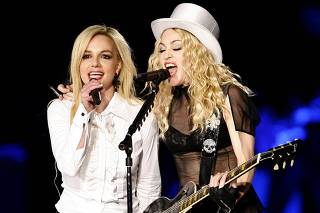 Madonna performs with Britney Spears during the Los Angeles date of her Sticky and Sweet tour at Dodgers stadium in Los Angeles