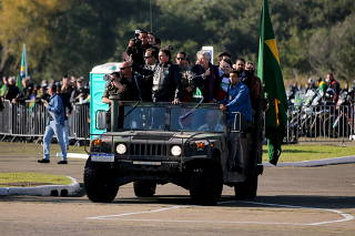 Brazil's President Bolsonaro leads a motorcade rally, in Porto Alegre