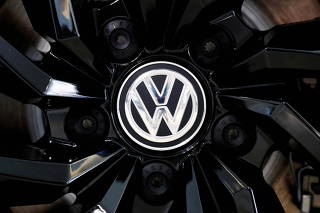 FILE PHOTO: The logo of German carmaker Volkswagen is seen on a rim cap in a showroom of a Volkswagen car dealer in Brussels