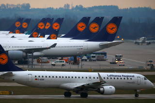 FILE PHOTO: Planes of German flagship carrier Lufthansa are parked on tarmac at Munich's airport