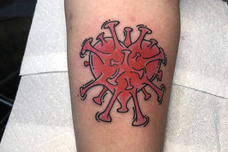 A provided image shows Rachael Sunshine, who said she survived contracting the coronavirus twice, of her tattoo of a heart with coronavirus spike proteins. (Rachel Sunshine via The New York Times)