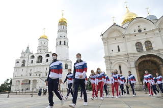 Russian Olympic athletes leave after a meeting with President Vladimir Putin in Moscow