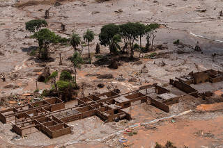 The debris of the municipal school of Bento Rodrigues district, which was covered with mud after a dam owned by Vale SA and BHP Billiton Ltd burst, is pictured in Mariana
