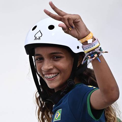 Brazil's Rayssa Leal reacts after performing a trick during the women's street preliminary round during the Tokyo 2020 Olympic Games at Ariake Sports Park Skateboarding in Tokyo on July 26, 2021. (Photo by Lionel BONAVENTURE / AFP)