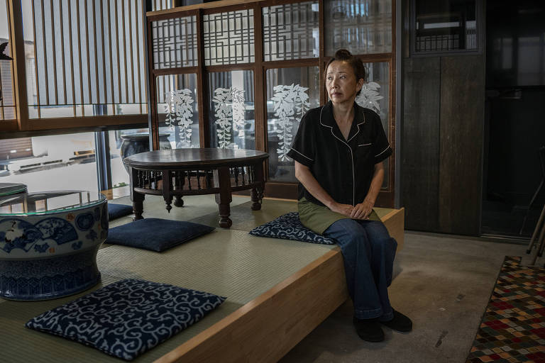 Toshiko Ishii, who runs a traditional hotel, in the Taito Ward of Tokyo, Aug. 6, 2021. Ishii spent over $180,000 converting the building's first floor into a restaurant in anticipation of a flood of tourists