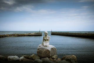 A granite mermaid in Asaa, Denmark, on Aug. 12, 2021.  (Carsten Snejbjerg/The New York Times)