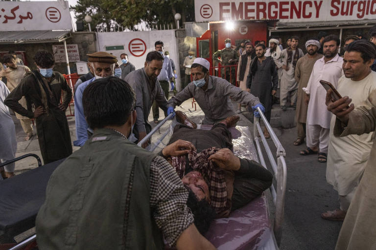 A person wounded in a bomb blast outside the Kabul airport in Afghanistan on Thursday, Aug. 26, 2021, arrives at a hospital in Kabul. The Pentagon confirmed at least two blasts outside the Kabul airport and said there were a number of casualties, after Western governments warned of a security threat there. (Victor J. Blue/The New York Times)