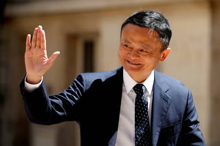 FILE PHOTO: Jack Ma, billionaire founder of Alibaba Group, arrives at the 