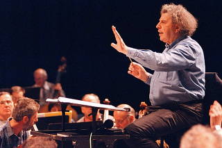 FILE PHOTO: Greek composer Mikis Theodorakis conducts the Skopje's opera orchestra during a rehearsal in the Macedonian capital
