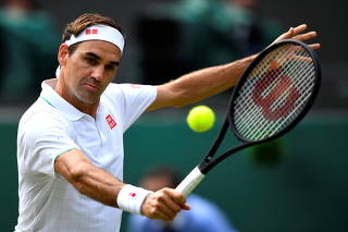 FILE PHOTO: Switzerland's Roger Federer in action during his third round match at Wimbledon