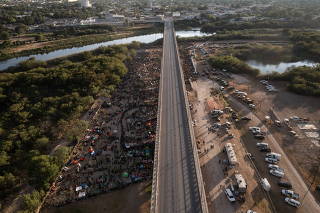 Migrants shelter near Del Rio International Bridge in Del Rio, Texas
