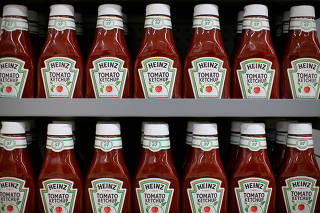 FILE PHOTO: Heinz tomato ketchup is show on display during a preview of a new Walmart Super Center prior to its opening in Compton, California