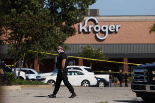 Emergency personnel respond to a shooting at a Kroger supermarket in suburban Memphis