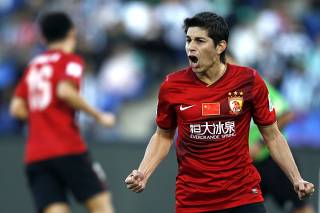 Dario Conca of China's Guangzhou Evergrande celebrates after scoring a goal against Brazil's Atletico Mineiro during their 2013 FIFA Club World Cup third place soccer match in Marrakech stadium