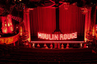 A 22-foot-wide, two-layered neon sign spells out the showÕs title at ÒMoulin Rouge! The MusicalÓ at the Al Hirschfeld Theatre in New York, Sept. 1, 2021. (Justin J Wee/The New York Times)