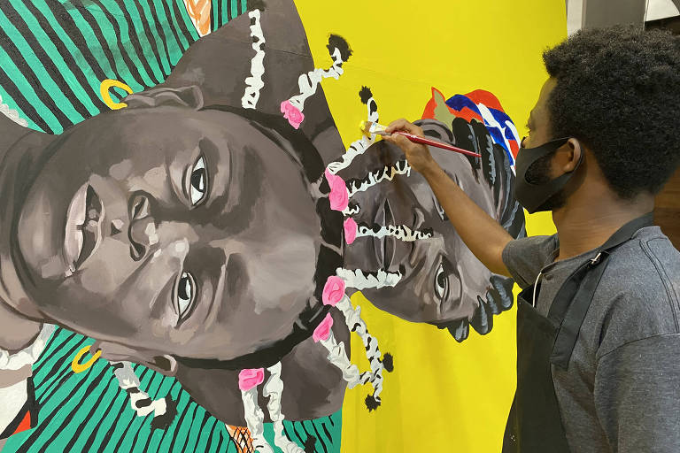Angolano expõe retratos gigantes de africanos vendedores de rua em SP