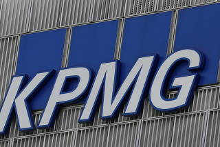 FILE PHOTO: The KPMG logo is seen at their offices at Canary Wharf financial district in London