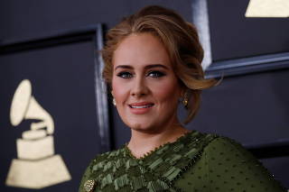 FILE PHOTO: Singer Adele arrives at the 59th Annual Grammy Awards in Los Angeles