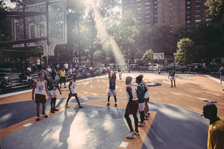 A basketball game at Rucker Park, prior to the start of renovations, in ManhattanÕs Harlem neighborhood, Aug. 14, 2021. (Anthony Geathers/The New York Times)