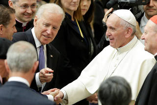 FILE PHOTO: U.S. Vice President Biden talks with Pope Francis in Paul VI hall at the Vatican