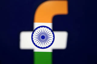 FILE PHOTO: India's flag is seen through a 3D printed Facebook logo in this illustration picture
