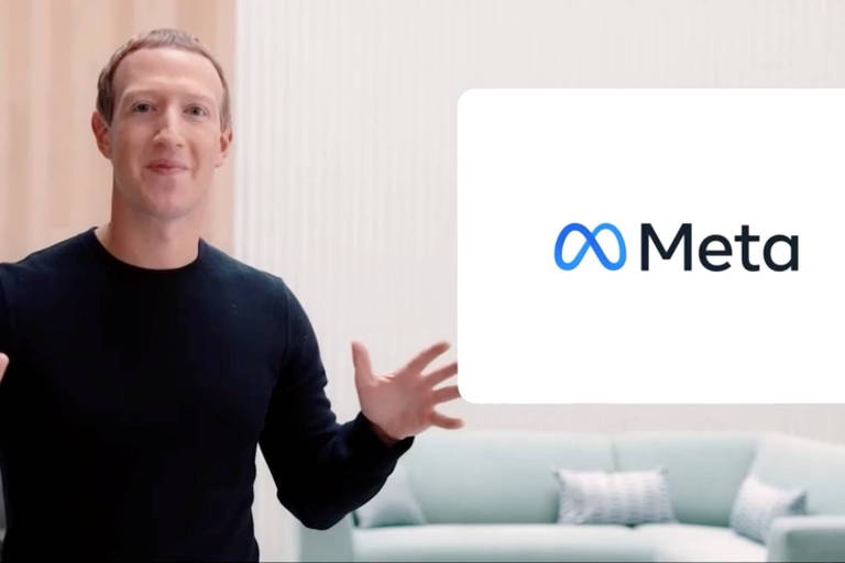 Mark Zuckerberg ao lado do novo logotipo da empresa