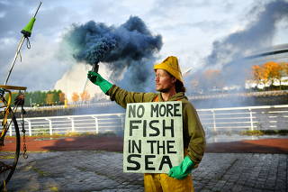 Ocean Rebellion activist Rob Higgs protests against bottom trawling during a demonstration in Glasgow